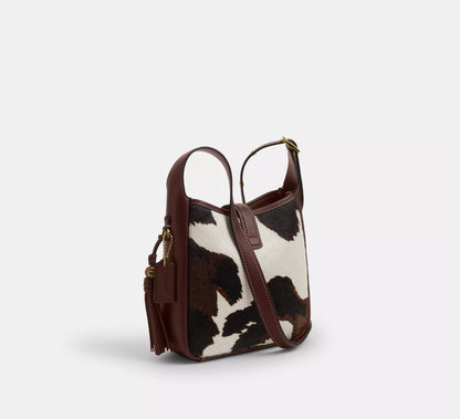 Hadley Mini Crossbody Bag With Cow Print And Tassel